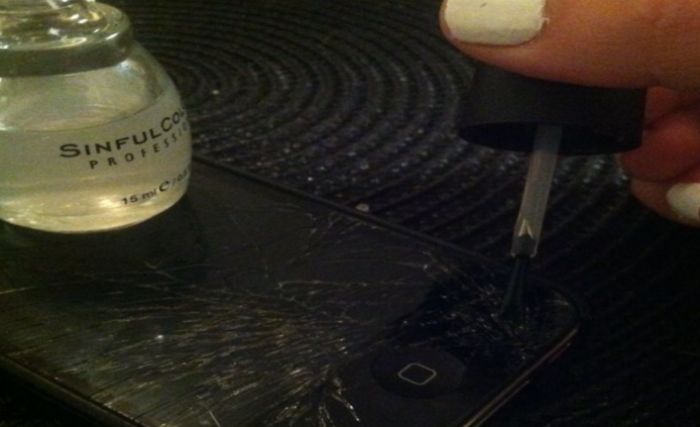 nail polish and cracked phone