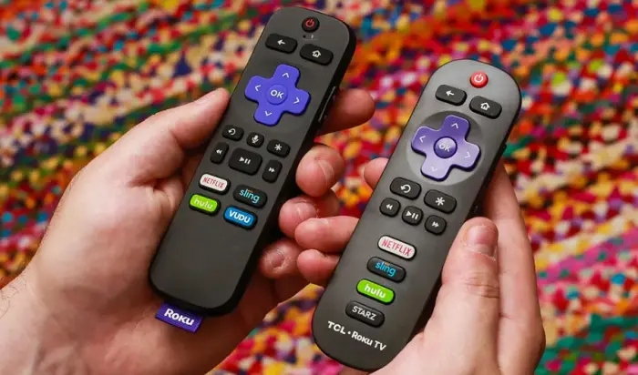 two roku remote on hand